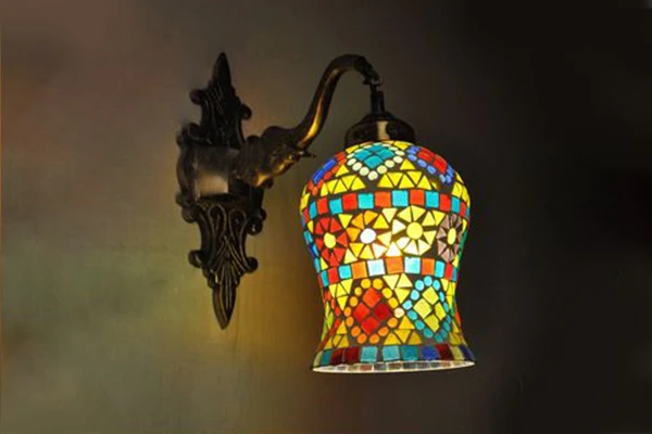 Mosaic wall light fixtures crafted by glass artisans